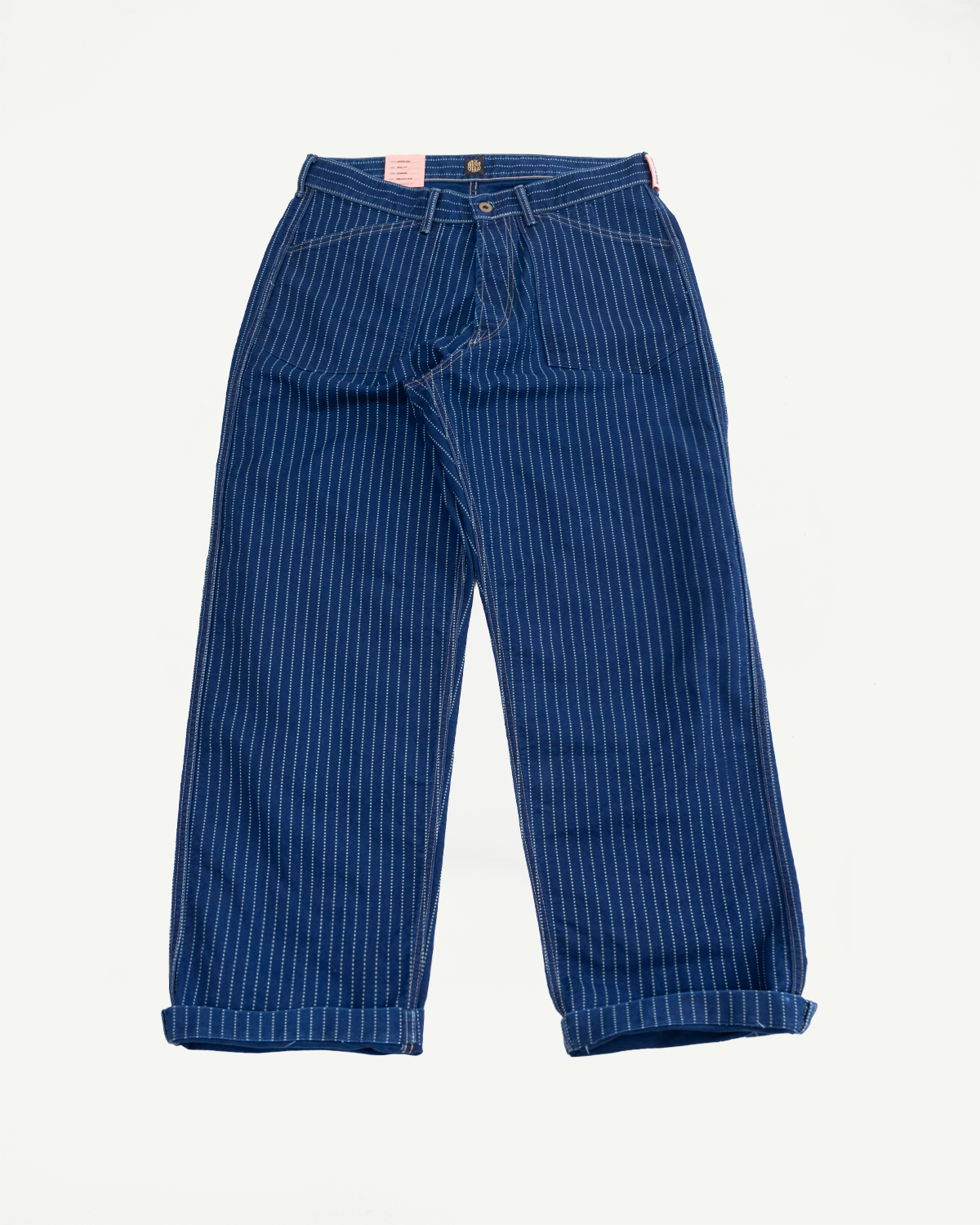 Front view flat lay of blue pinstripe trousers with cuffed hems.