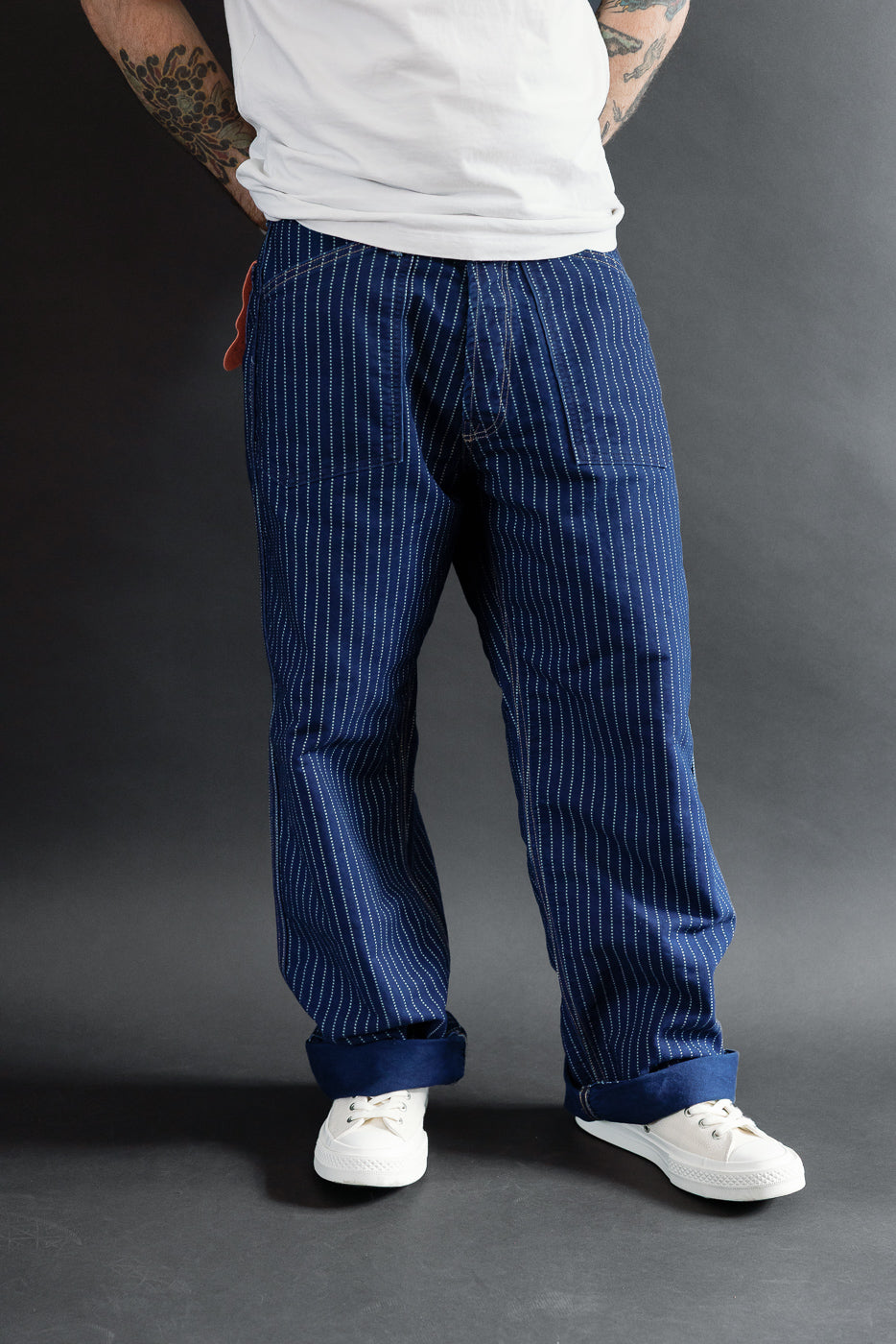 Rear view of navy pinstripe trousers on a 5'9