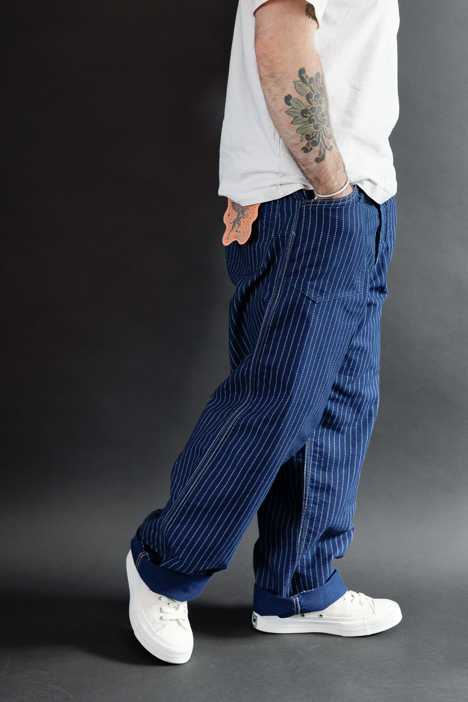 Side view of blue pinstripe pants on a 5'9