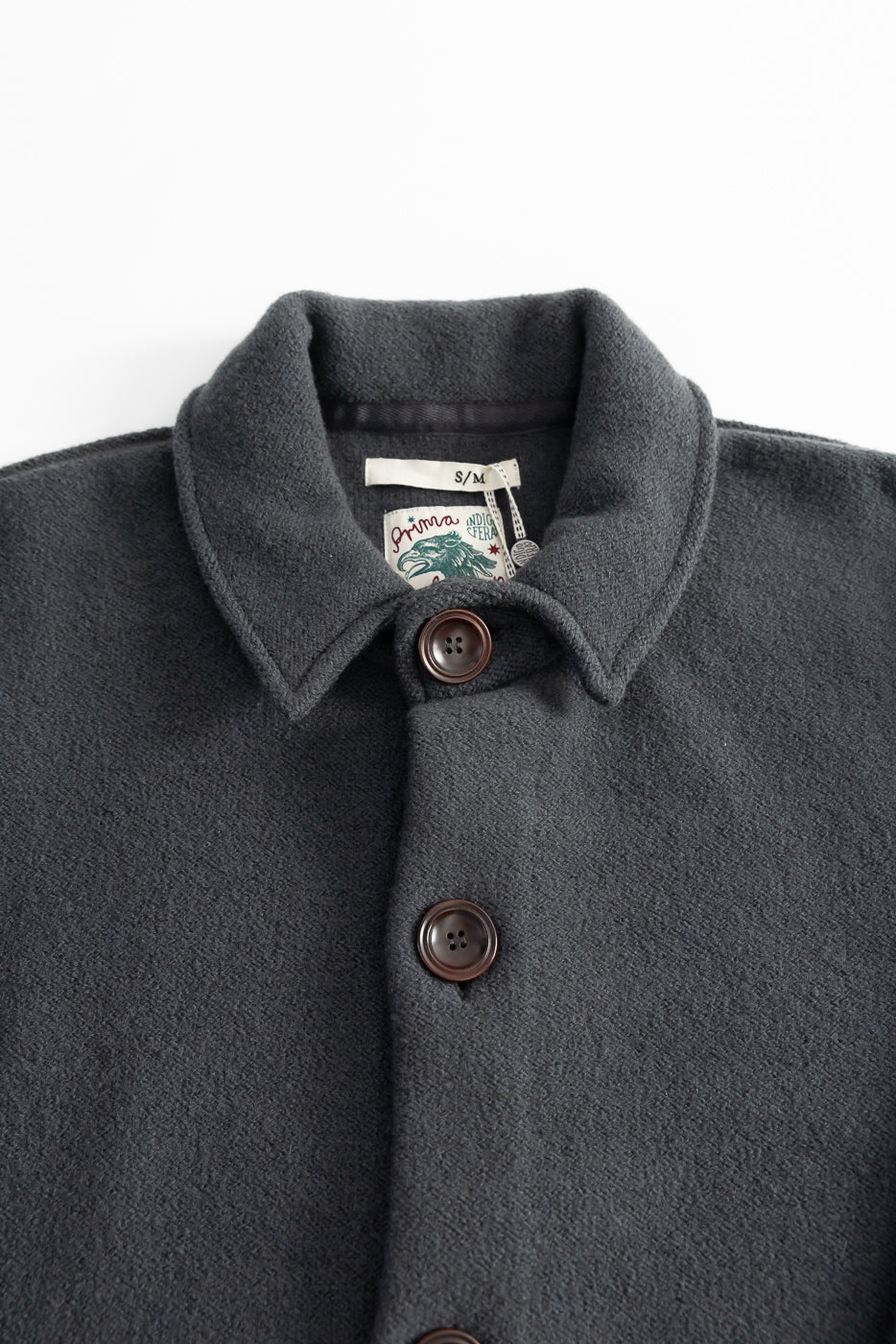 Indigofera Brewster dark grey boiled wool shirt with large buttons, close-up detail