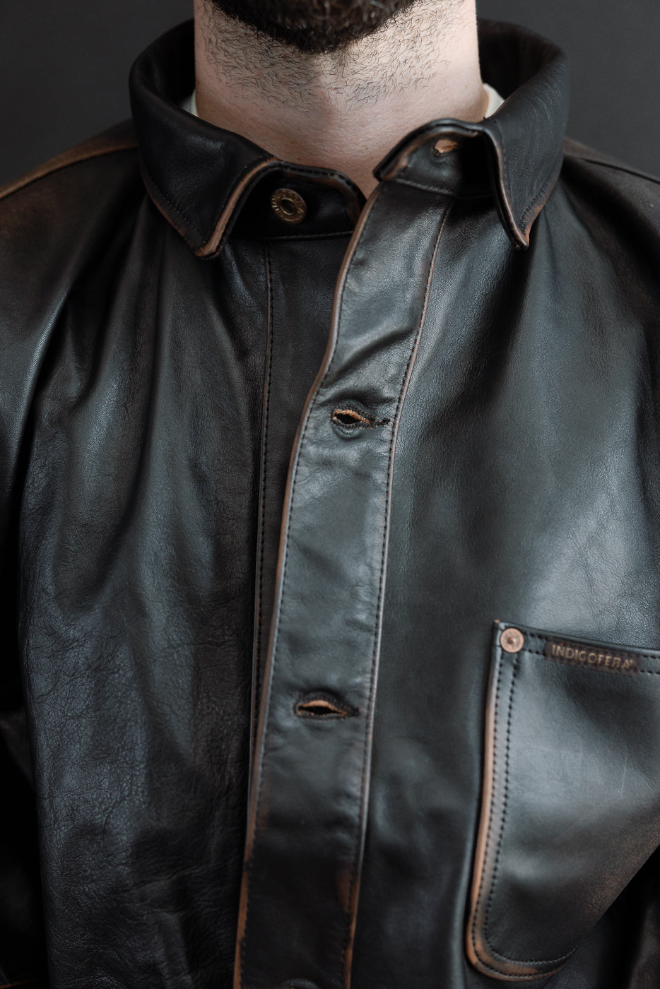 Close-up front of a black leather jacket on a 5'9