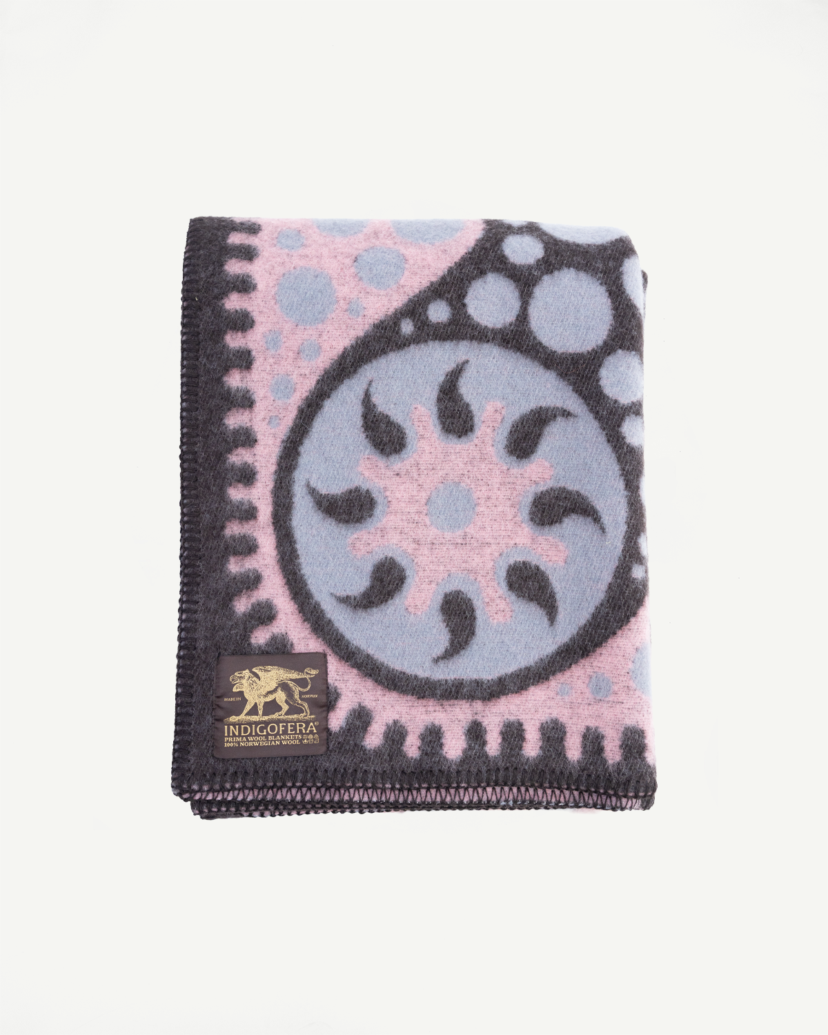 Folded Pink and blue patterned blanket with a brand logo on a white background