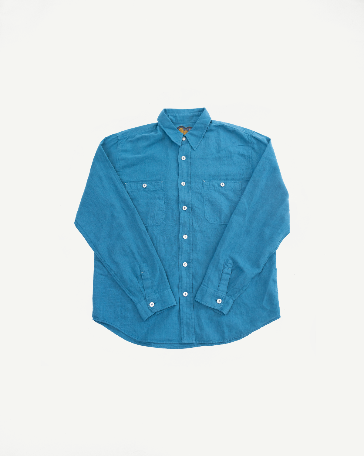 Flat lay front of men's ocean blue canvas shirt, button-down collar, chest pockets, Dant shop
