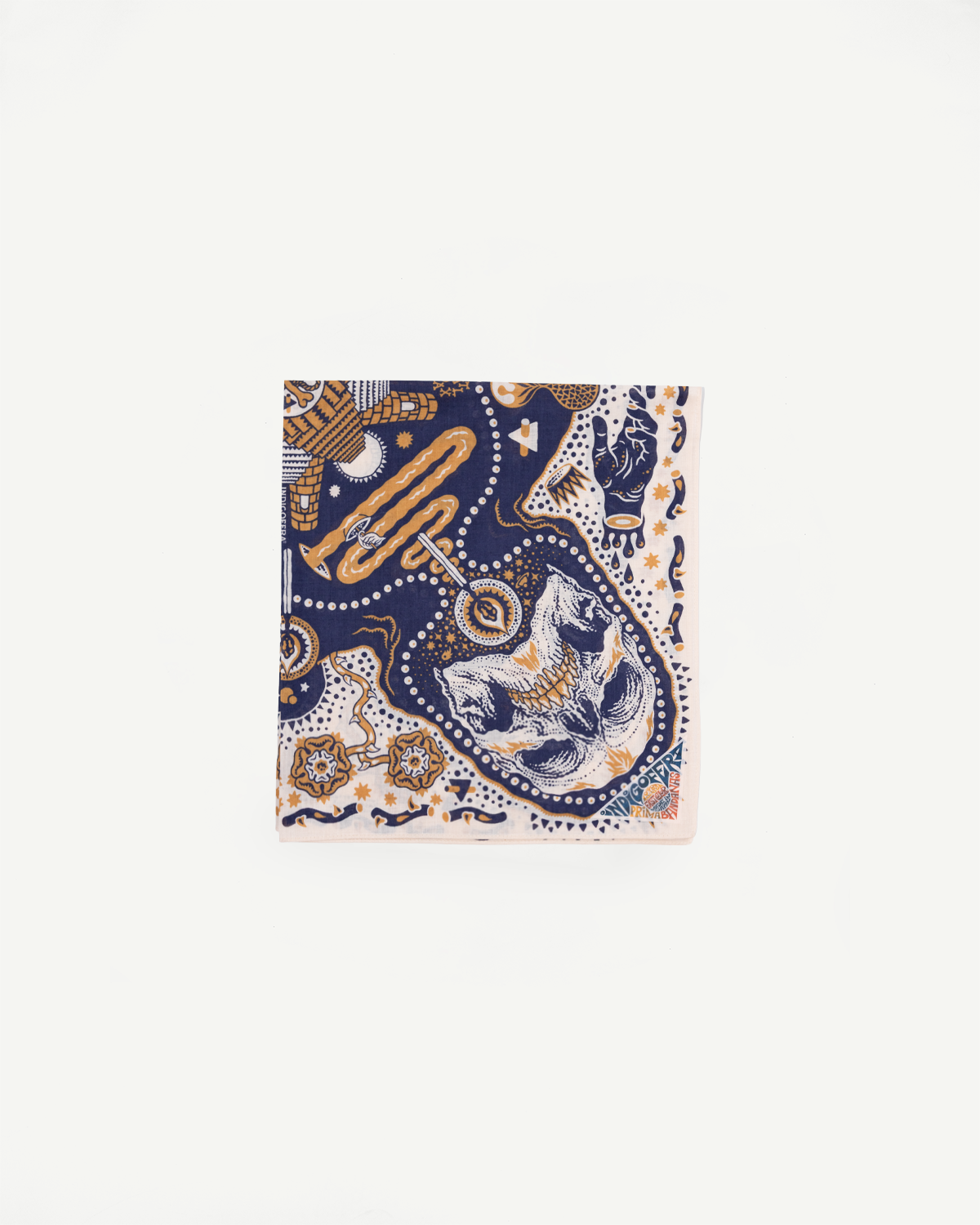 Front view of patterned bandana with skull, snakes, and geometric designs in navy and gold.