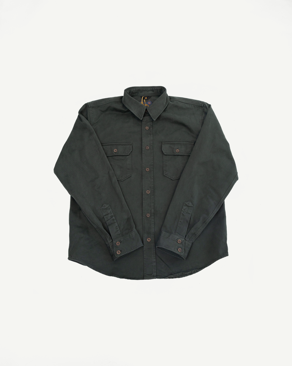 Front view flat lay of a dark grey long-sleeve button-down shirt with two chest pockets.