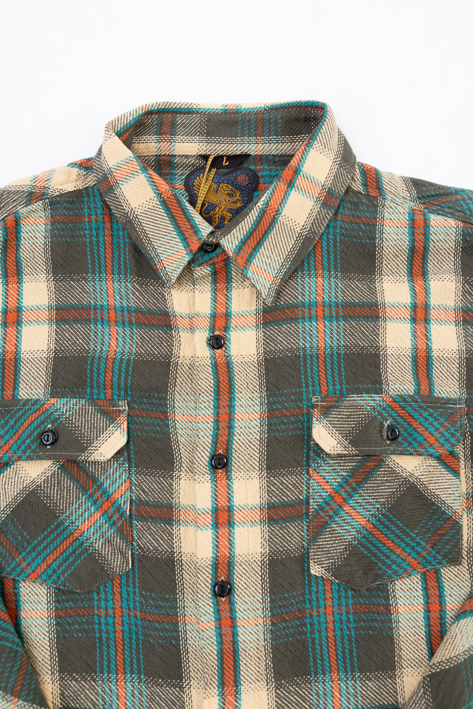 Front close-up of a plaid shirt showing the collar, buttons, and chest pockets.