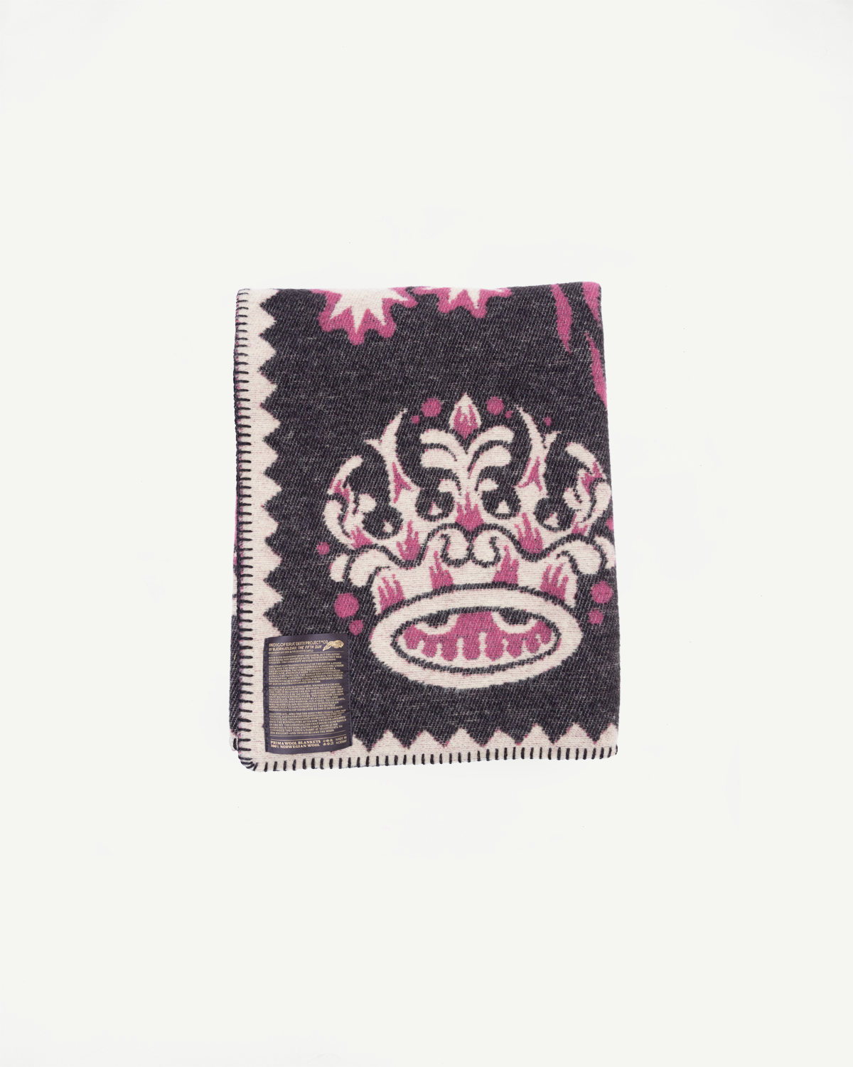 Flat lay front view of a patterned wool blanket with a pink crown design on dark grey fabric.