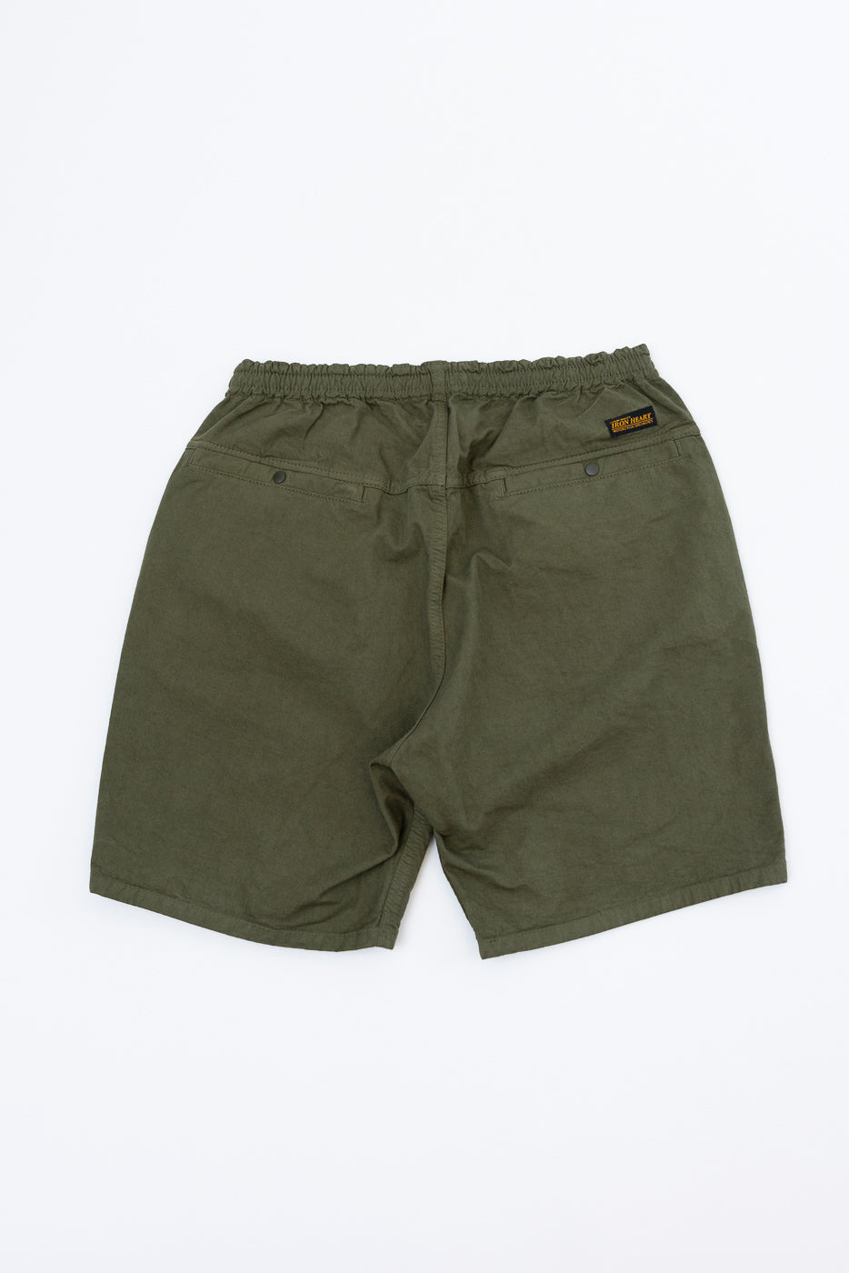 Back view flat lay of olive green men's shorts with elastic waist, rear pockets, and brand patch.