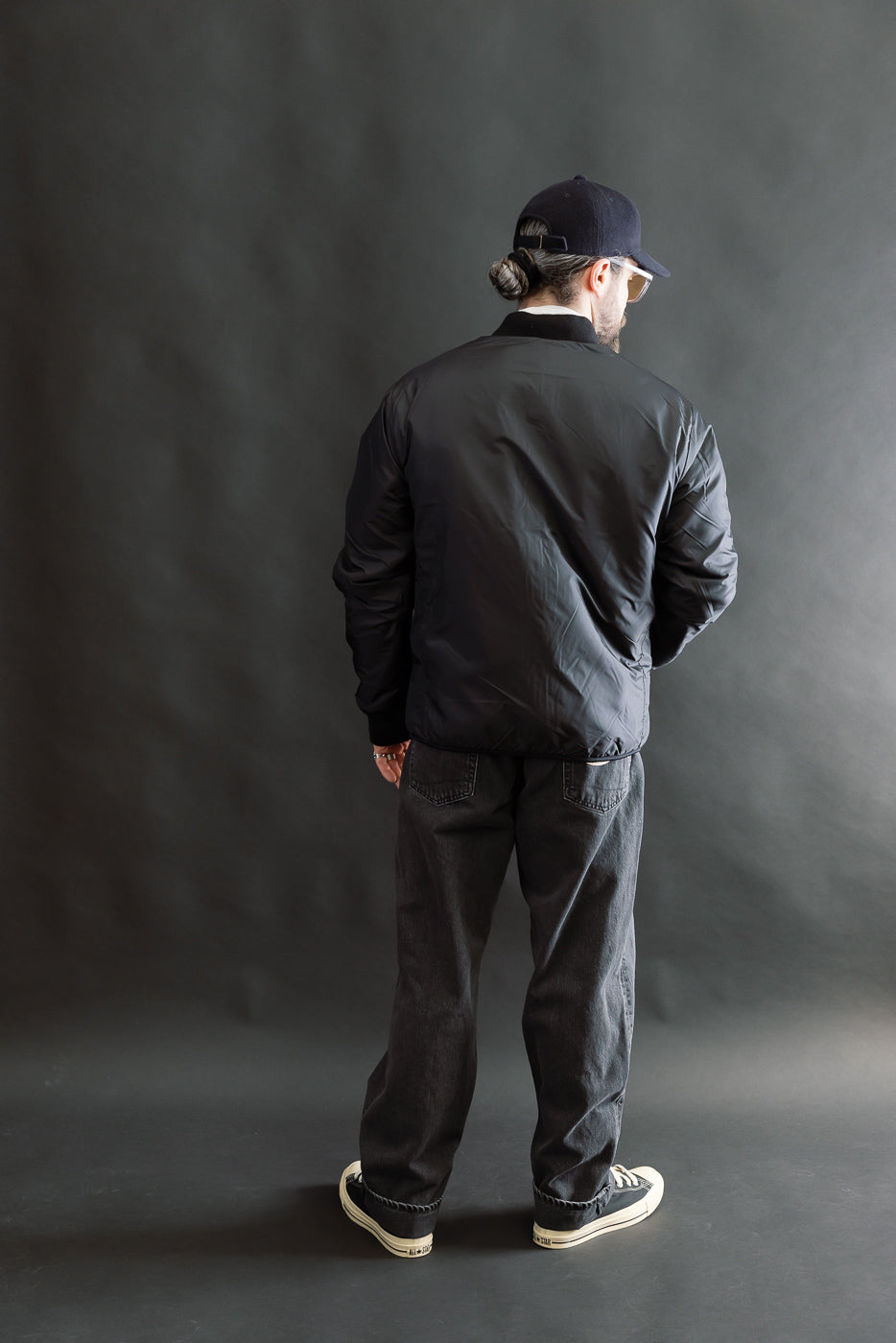 Full body, back view of male model 5'9