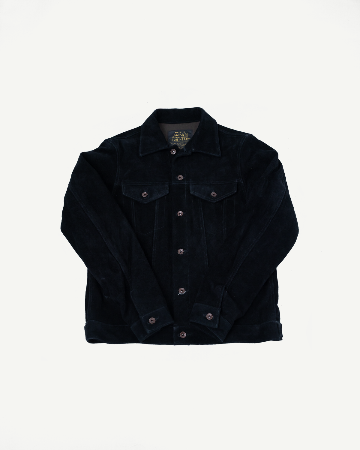 Black corduroy jacket front view, button closure, chest pockets, collar tag reads 'Made in Japan Iron Heart'