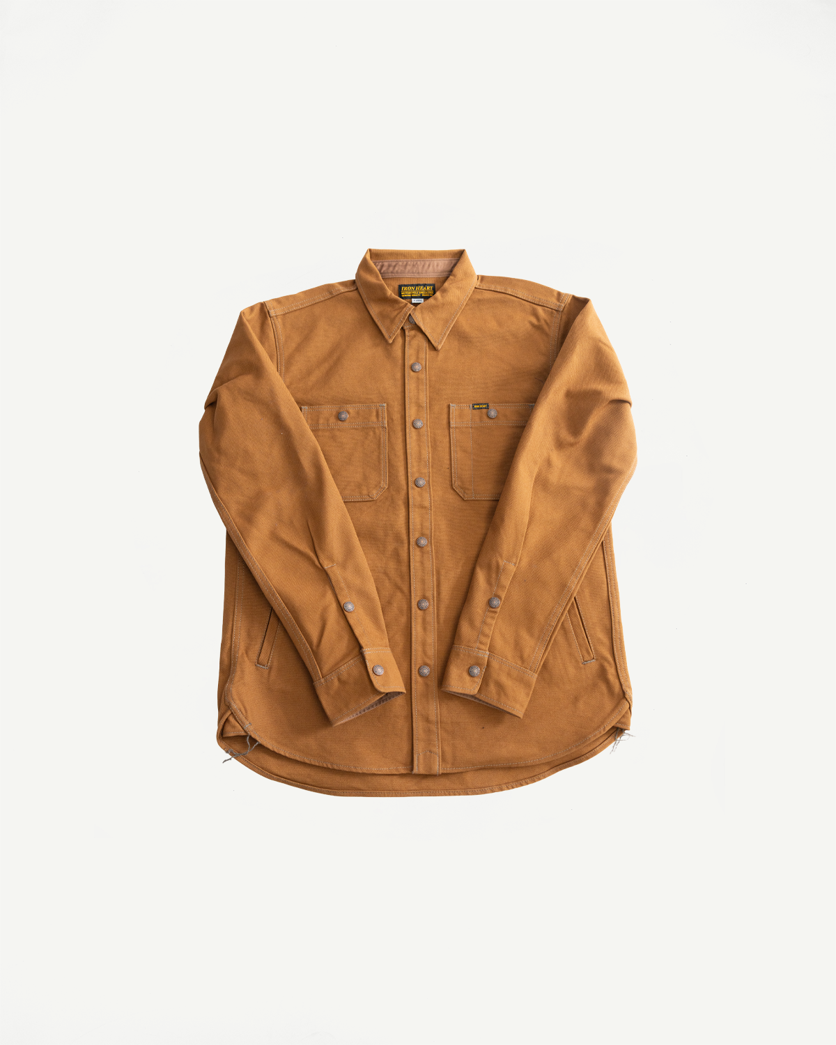 Flat lay front view of brown duck work shirt, showing button closure, chest pockets, collar, and long sleeves.