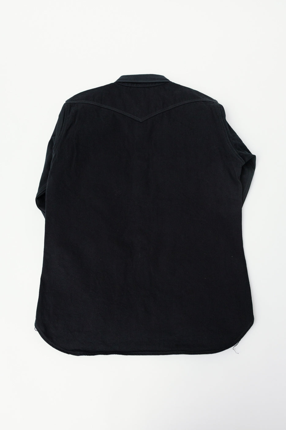 Flat lay of Iron Heart IHSH-218 black selvedge denim western shirt, back view, showing yoke and curved hem.