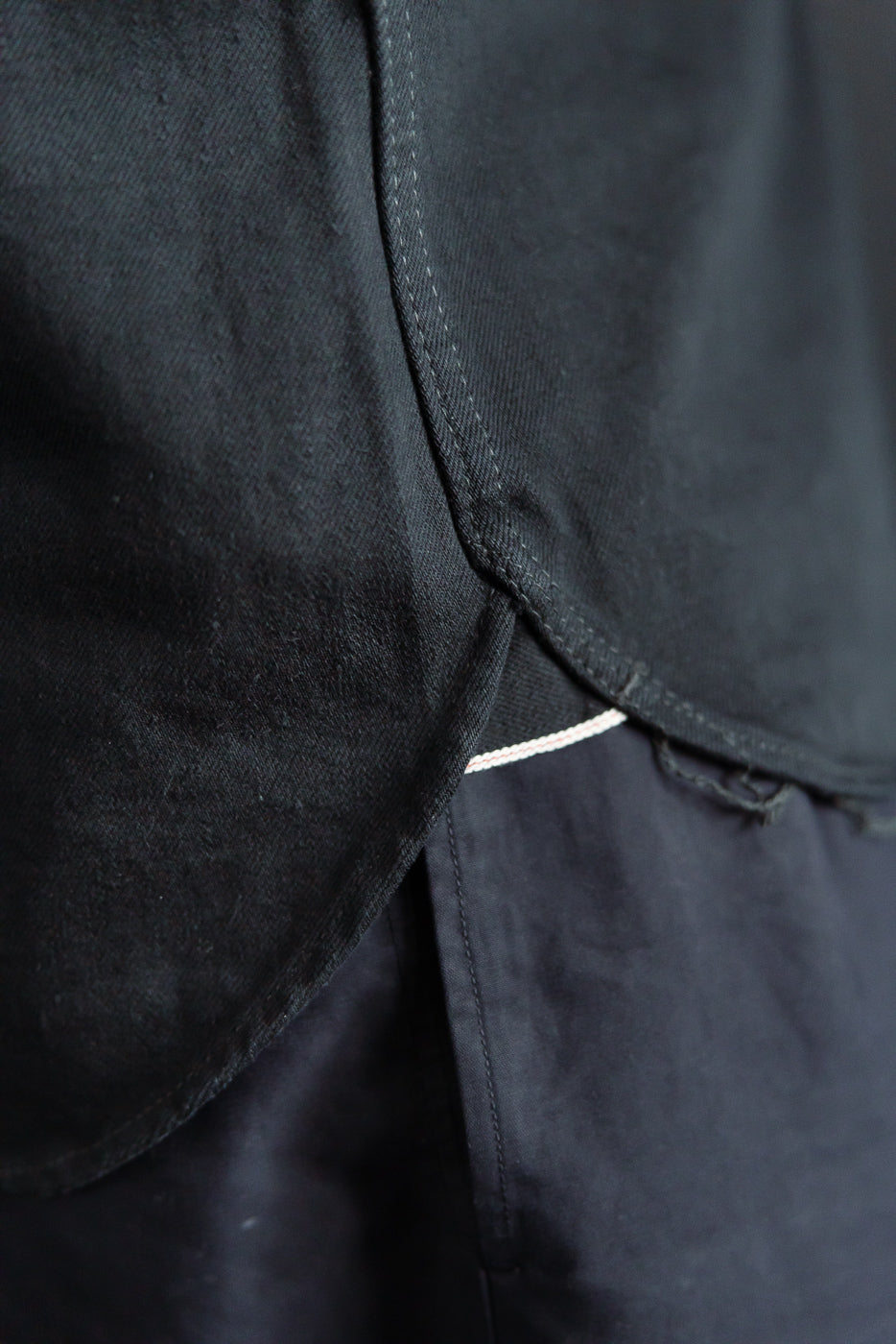 Close-up of Iron Heart IHSH-218 black selvedge denim western shirt curved hem side detail