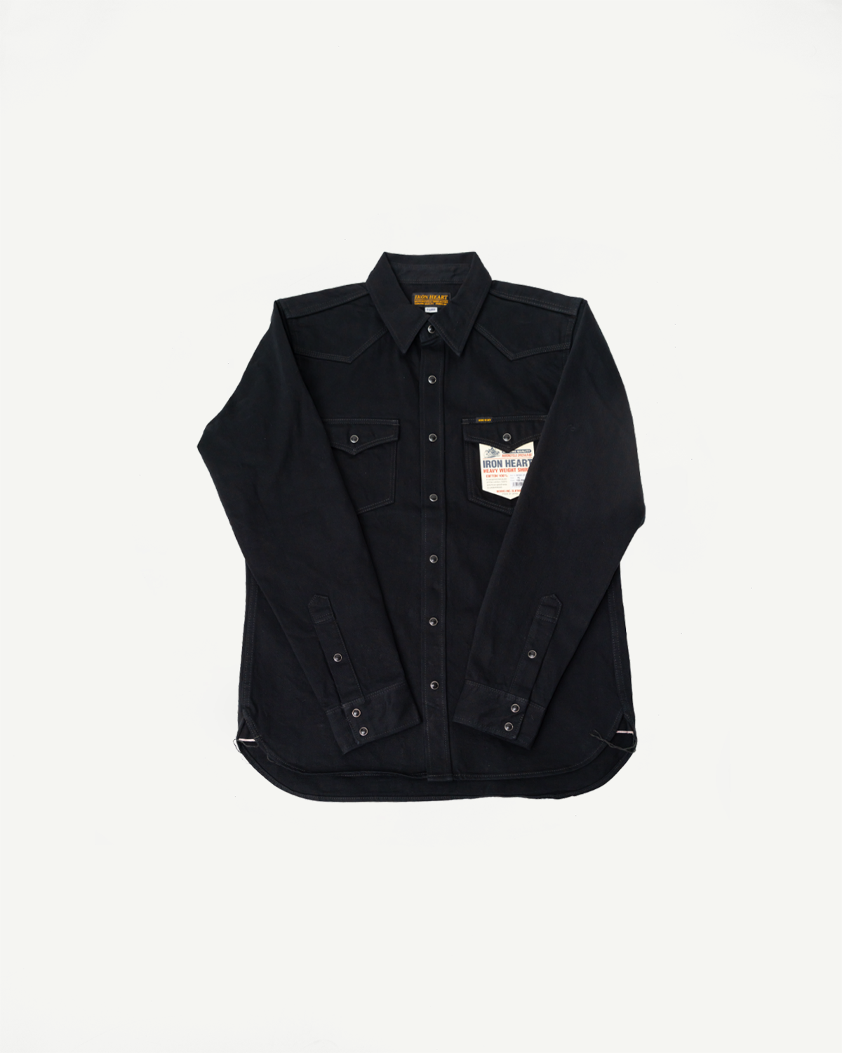Flat lay of Iron Heart IHSH-218 black selvedge denim western shirt, front view, classic collar, snap buttons, chest pockets, visible brand tag.