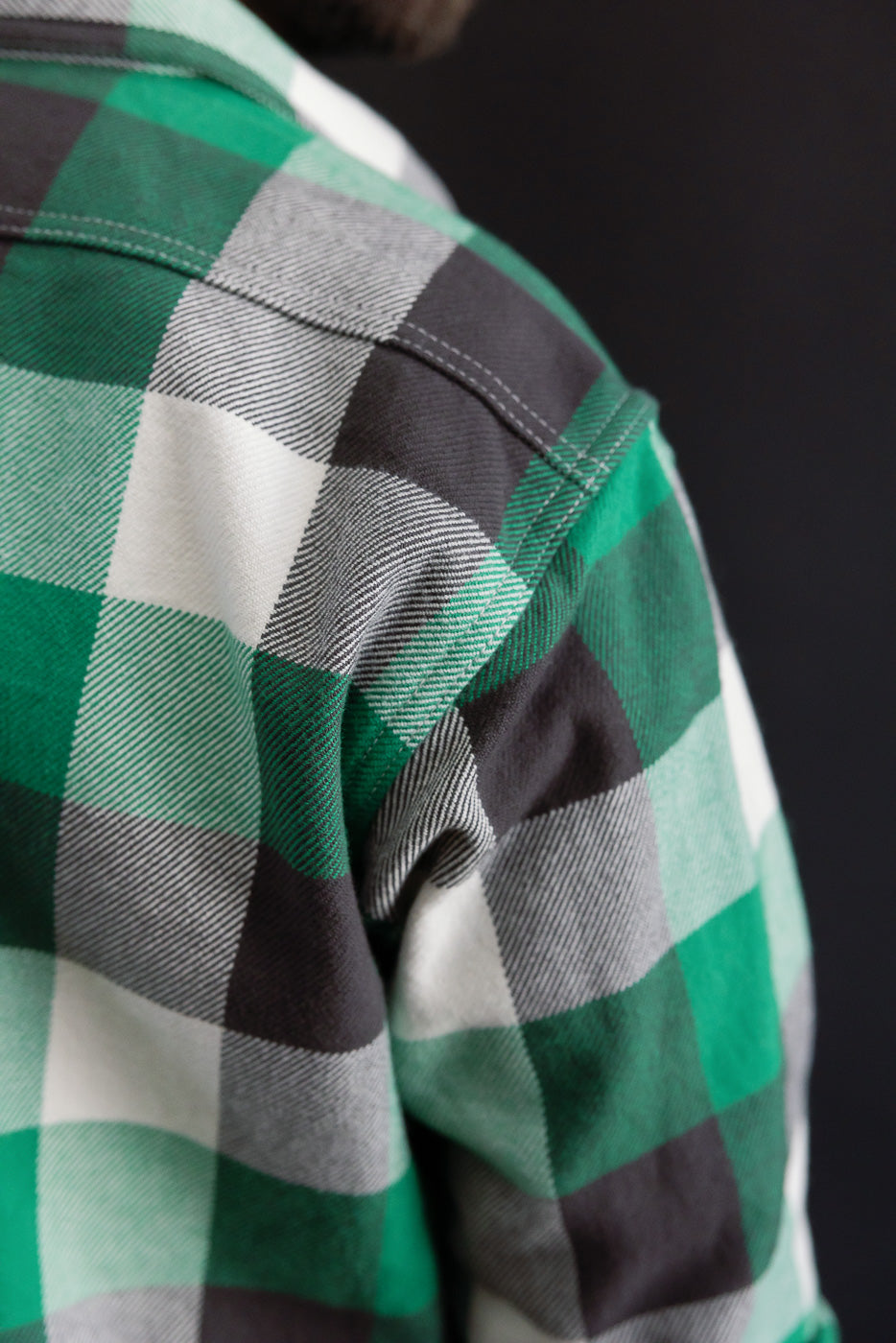 Close-up of Iron Heart green ultra heavy flannel work overshirt, rear shoulder detail