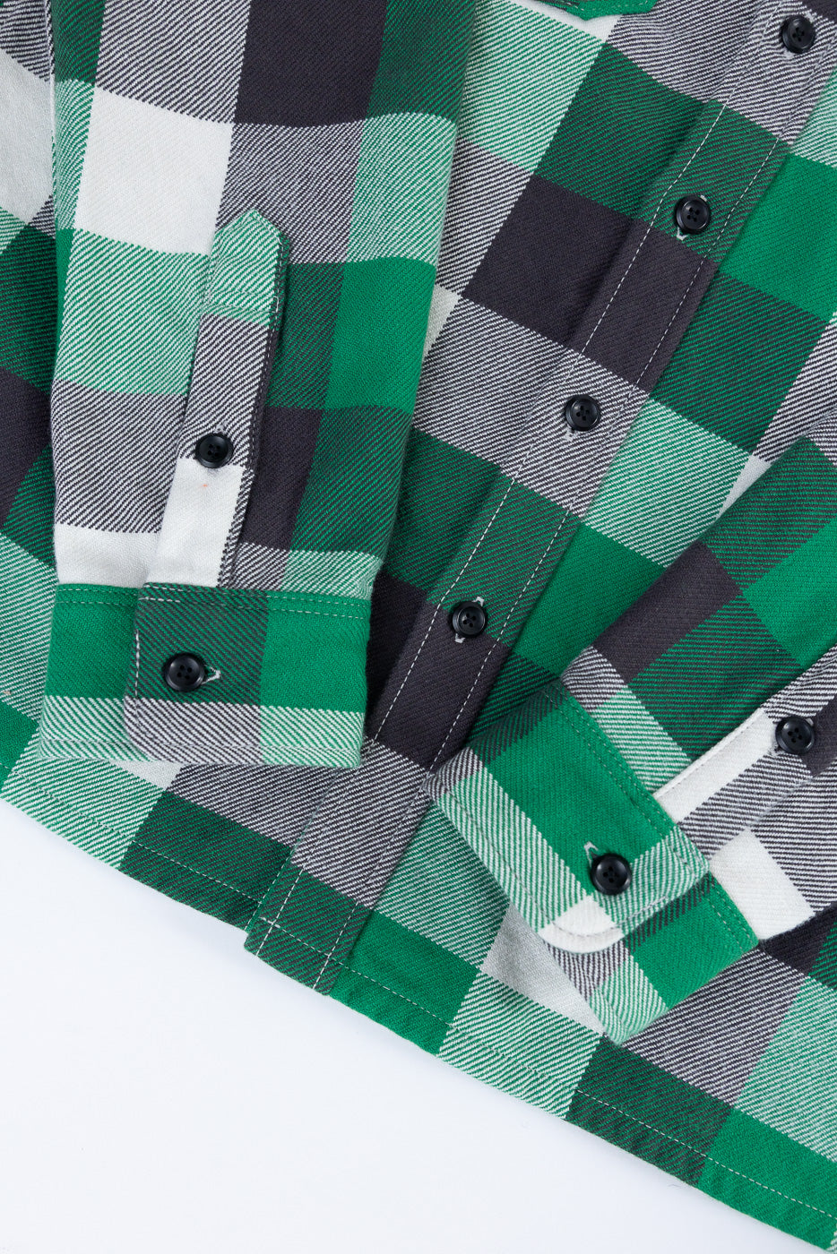 Close-up of Iron Heart green check flannel workshirt front sleeve cuff, button detail, heavy fabric