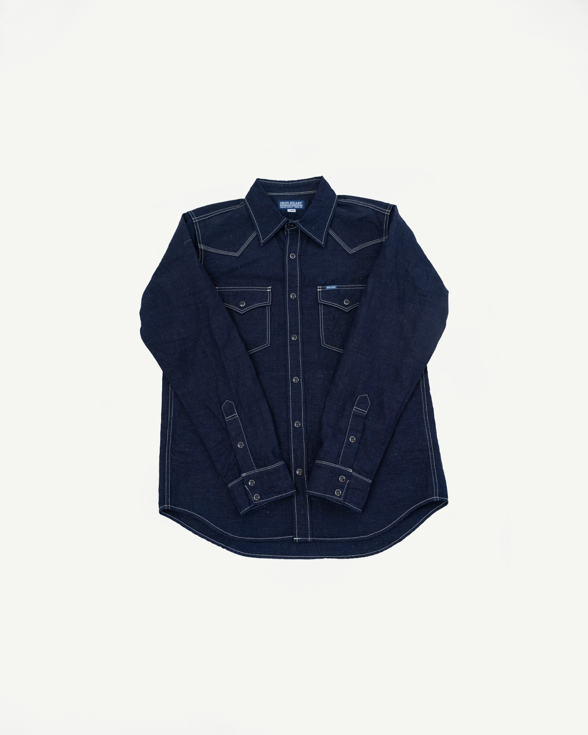 IHSH-444-IND - 7oz Cotton Linen Chambray Western Shirt - Indigo: A dark-indigo, long-sleeve Western-style denim shirt featuring contrast white stitching, pointed yokes, snap fastenings, and dual flap chest pockets, laid flat.