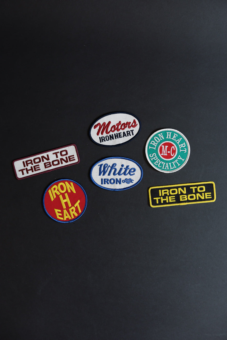 Iron Heart patches collection, front view, various designs and colors on black background
