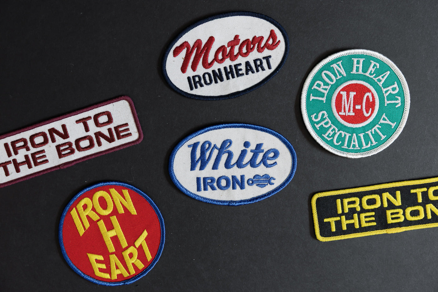 Iron Heart patches collection, front view, embroidered designs with bold text and colors