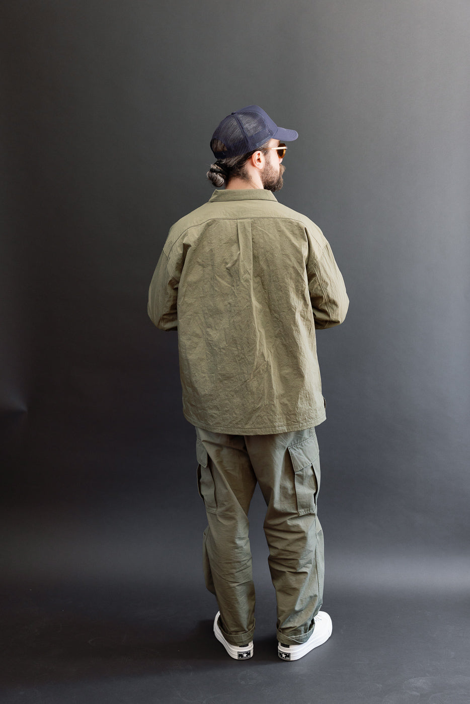 Full body back view of an athletic male model, 5'9
