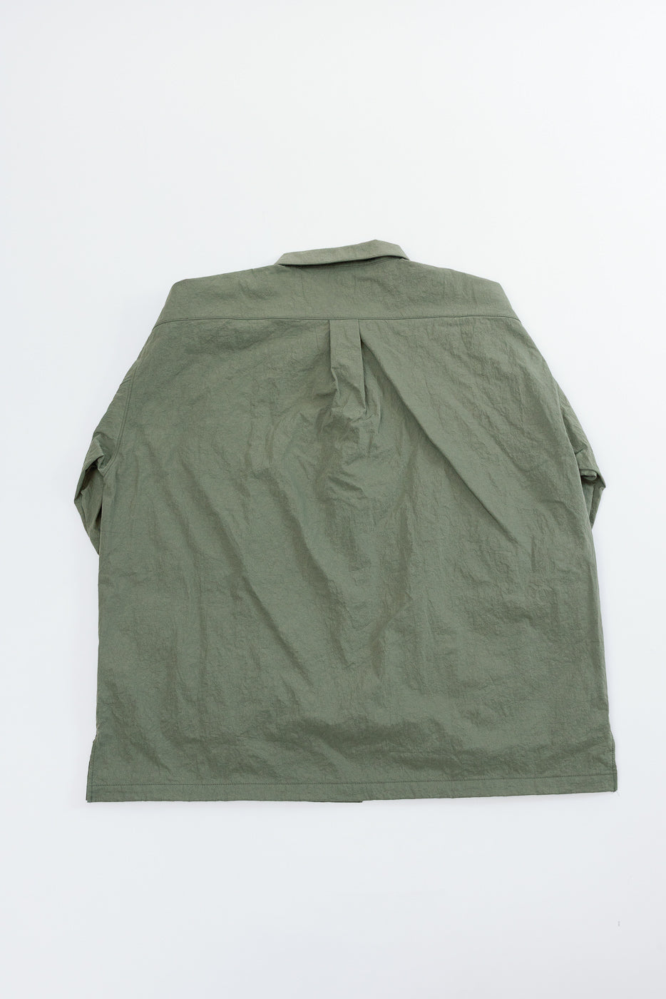 Flat lay showing the back of an olive green casual button-down shirt.