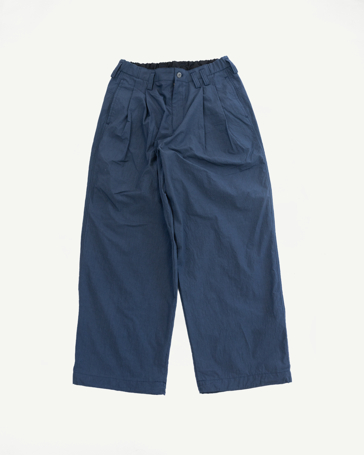 Flat lay front view of navy blue wide-leg casual pants with pleated front, button closure, and elastic waistband