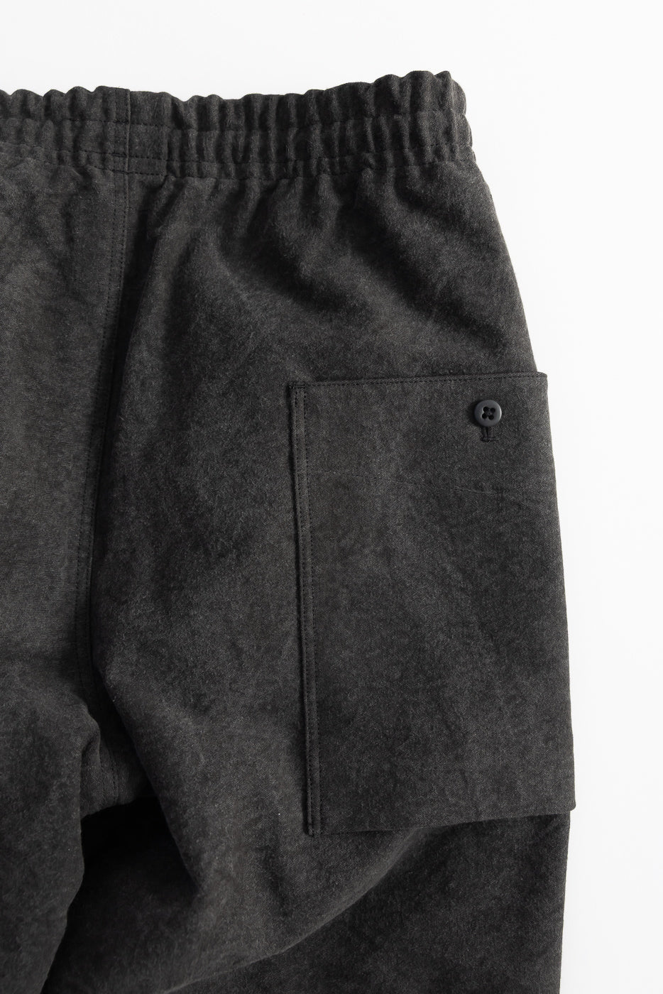 Close-up of Jackman JM4575 Sumi Ump Pants in black, flat lay of back pocket and elastic waistband, contemporary casual menswear at Dant