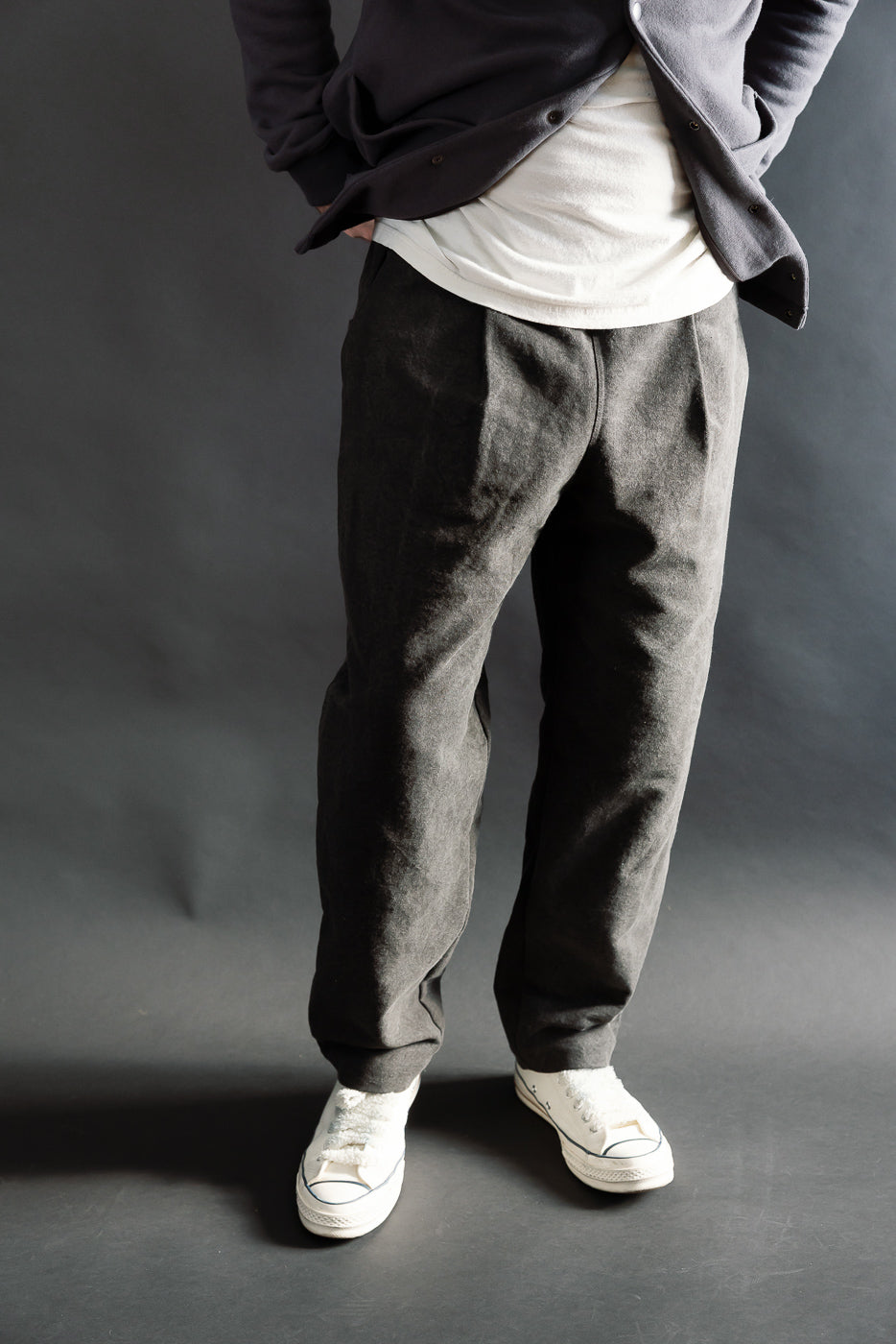 Front view of black Sumi Ump pants on male model, 5'9