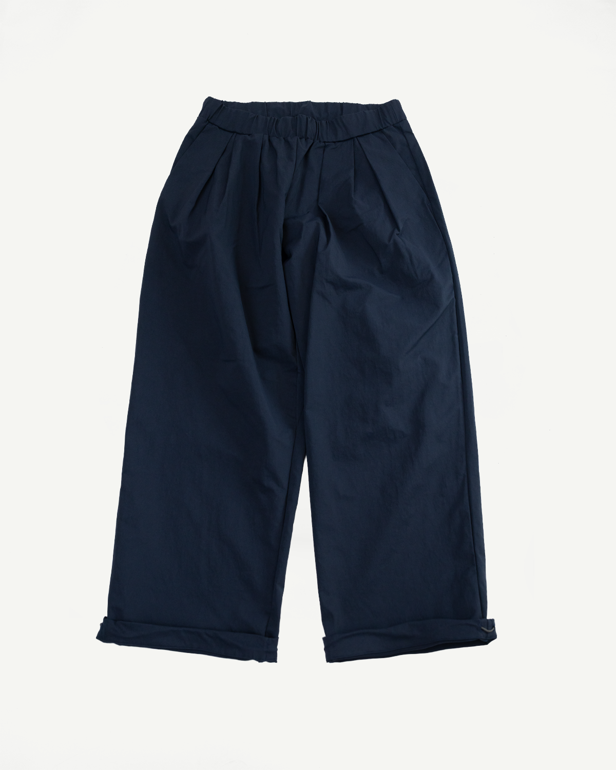 Navy blue wide-leg pants with elastic waist and cuffed hems, front view flat lay