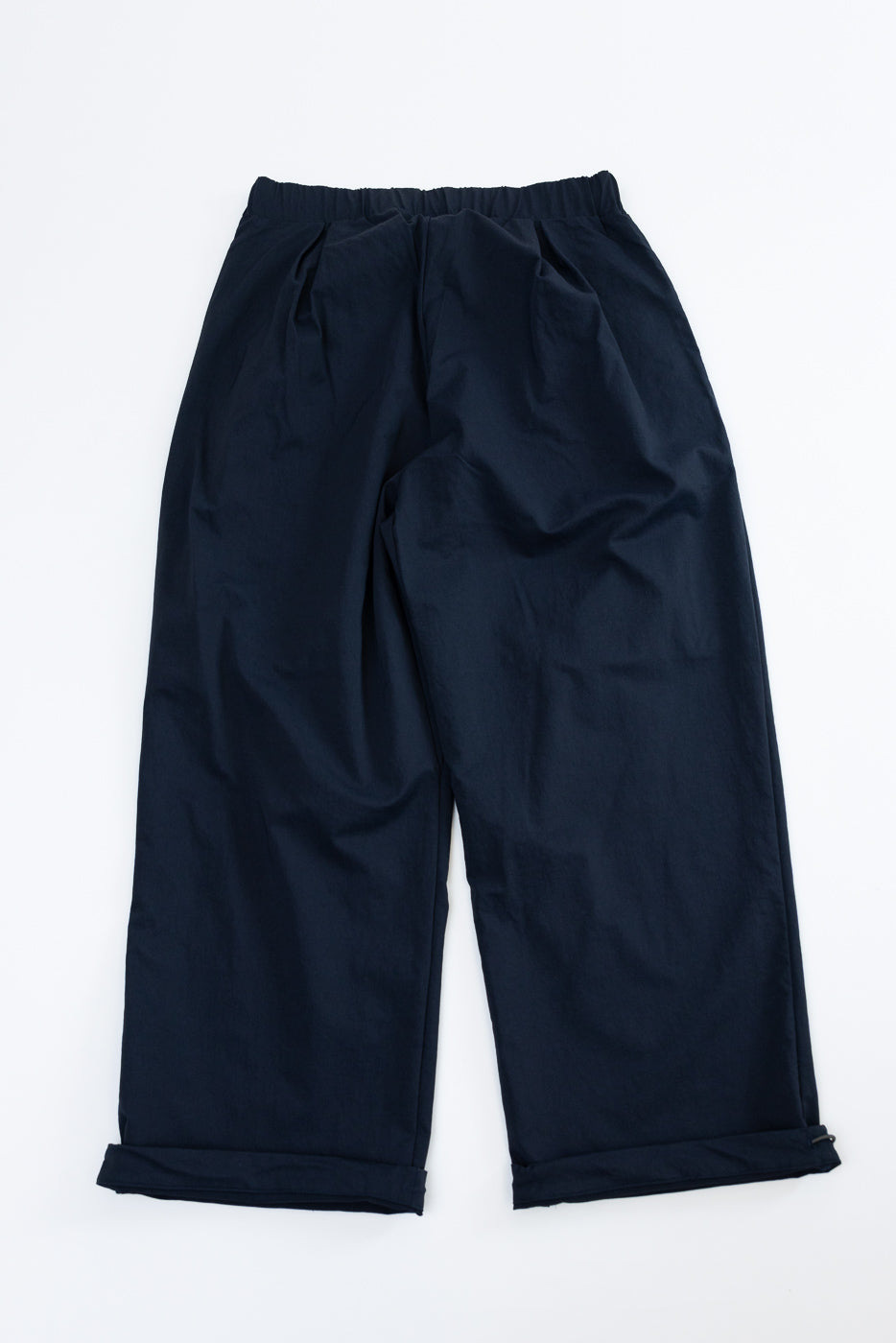 Flat lay front view of navy wide-leg casual pants with elastic waist and cuffed hems