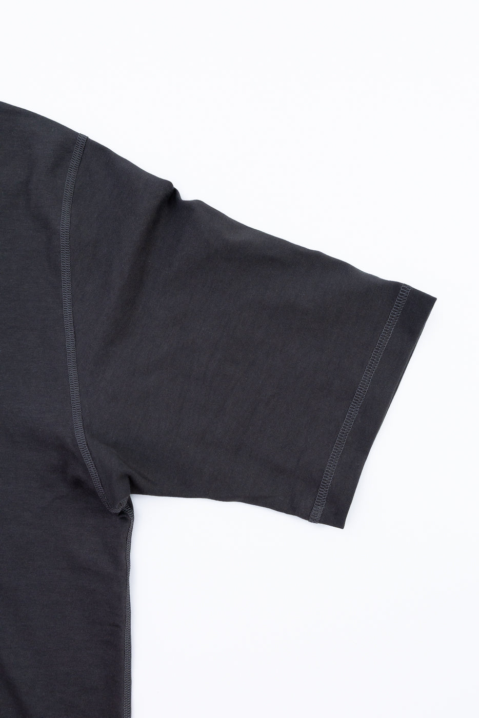 Black t-shirt sleeve on a white background
