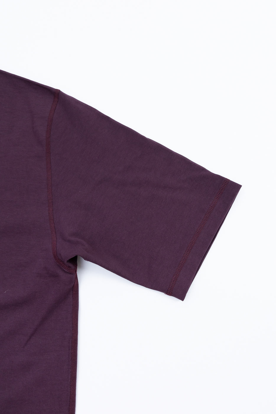 Maroon t-shirt on a white background