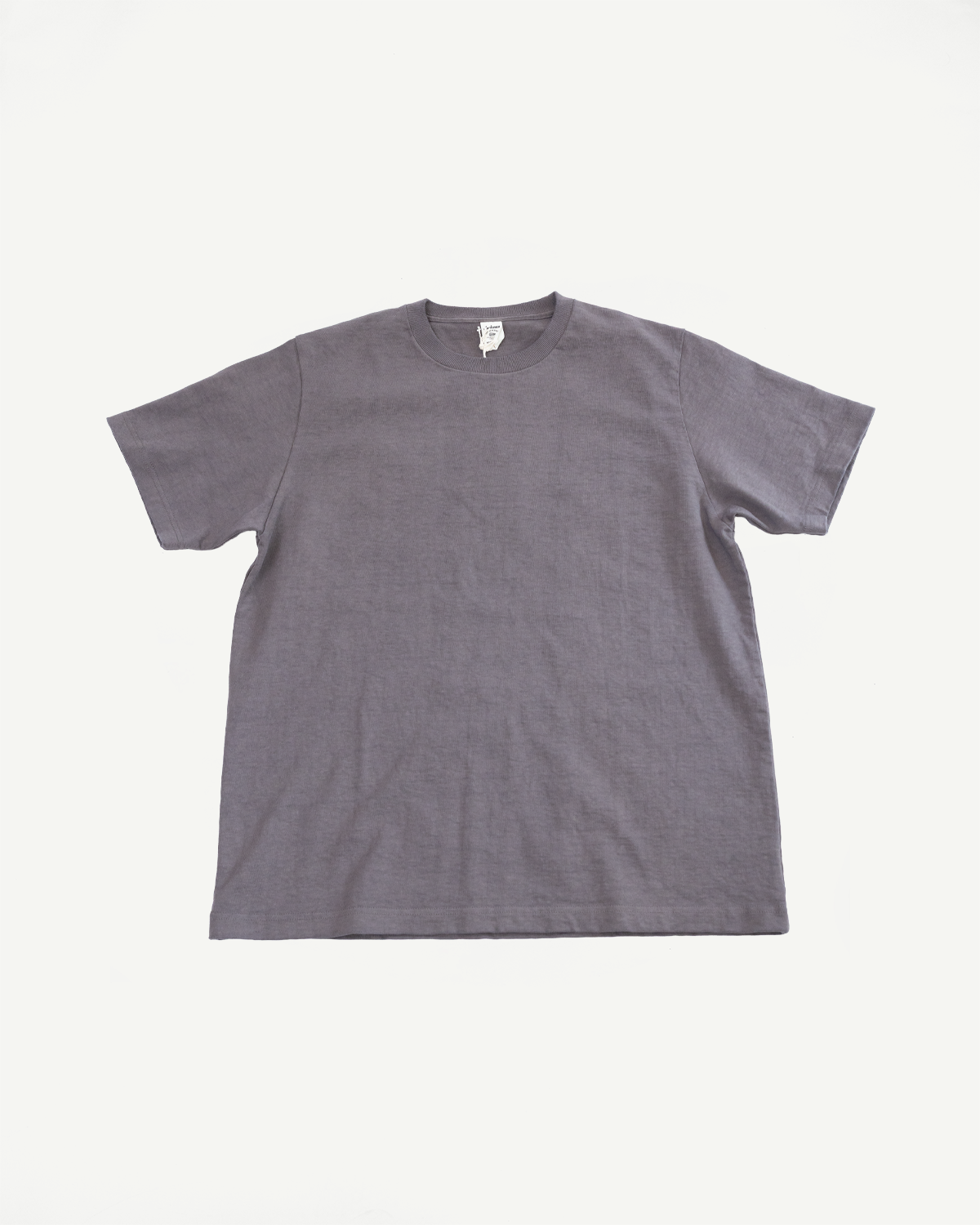 Gray crew neck t-shirt flat lay, front view showing ribbed collar, short sleeves, and tag detail.