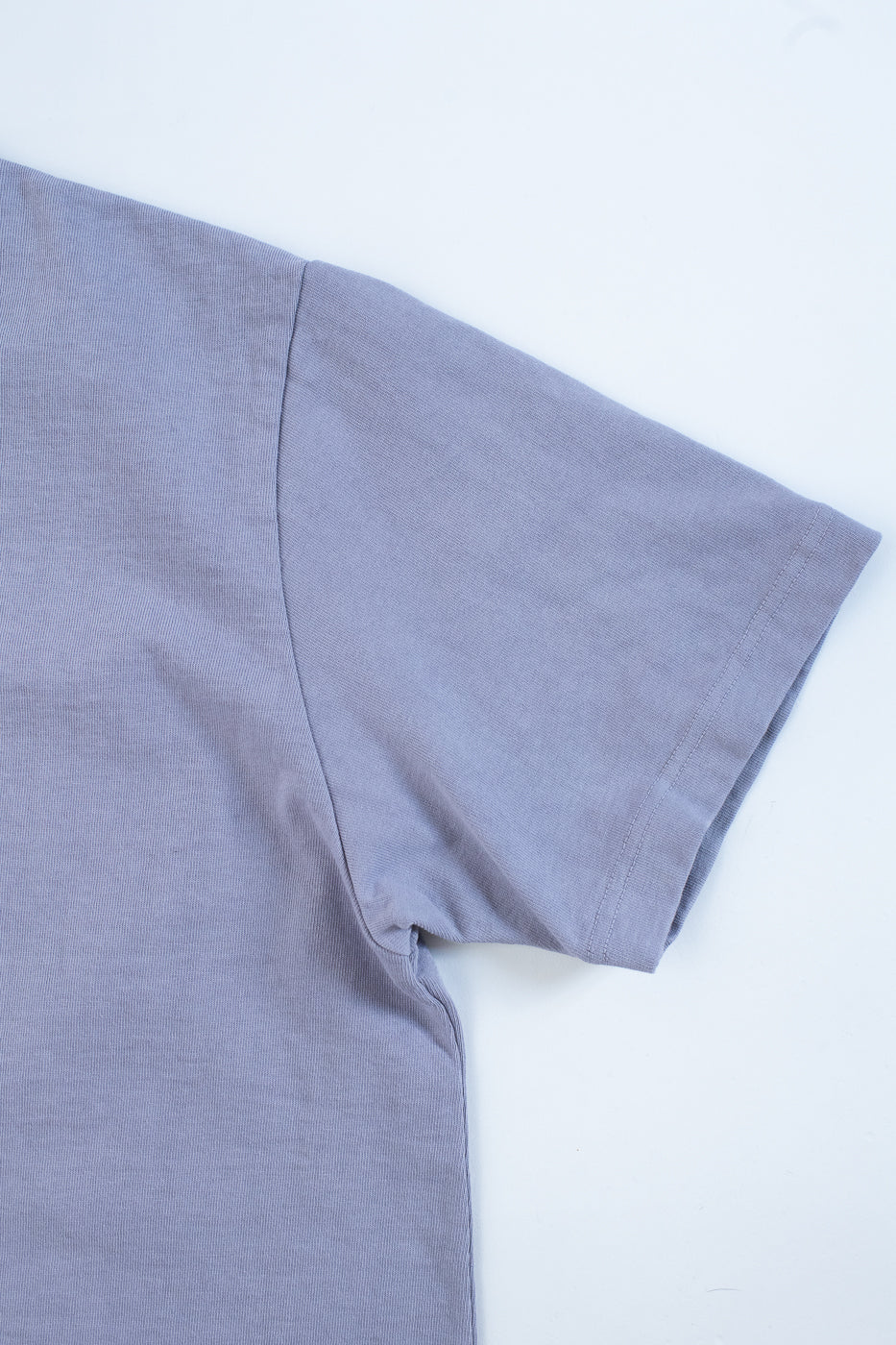 Close-up of a light purple fabric on a white background
