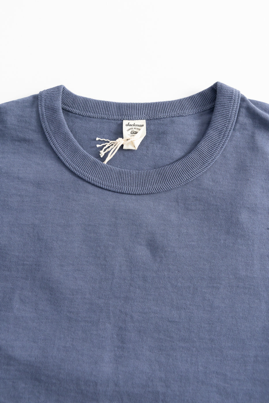 Close-up of Jackman classic navy dotsume t-shirt front, crew neck and fabric texture detail.