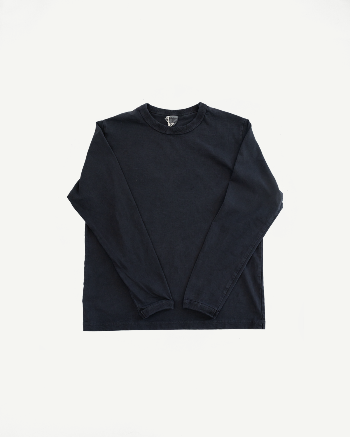 Front flat lay of dark navy long-sleeve tee with ribbed crew neck and hem details