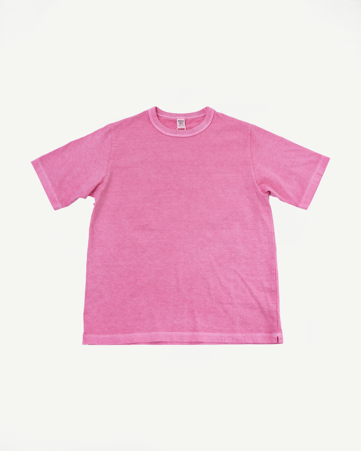 Pink short-sleeve t-shirt flat lay, front view, ribbed crew neck, tag visible, casual apparel