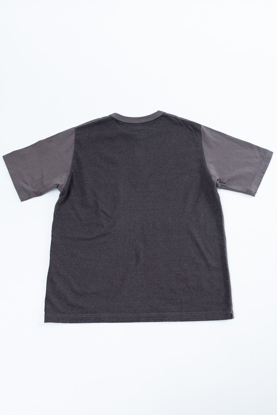 Back view flat lay of dark grey short sleeve t-shirt with contrasting sleeves and ribbed crew neck.
