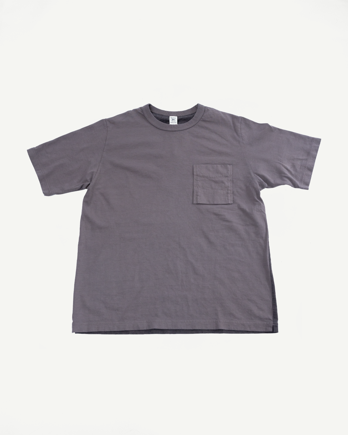Gray t-shirt flat lay front view, chest pocket, ribbed collar, tag detail