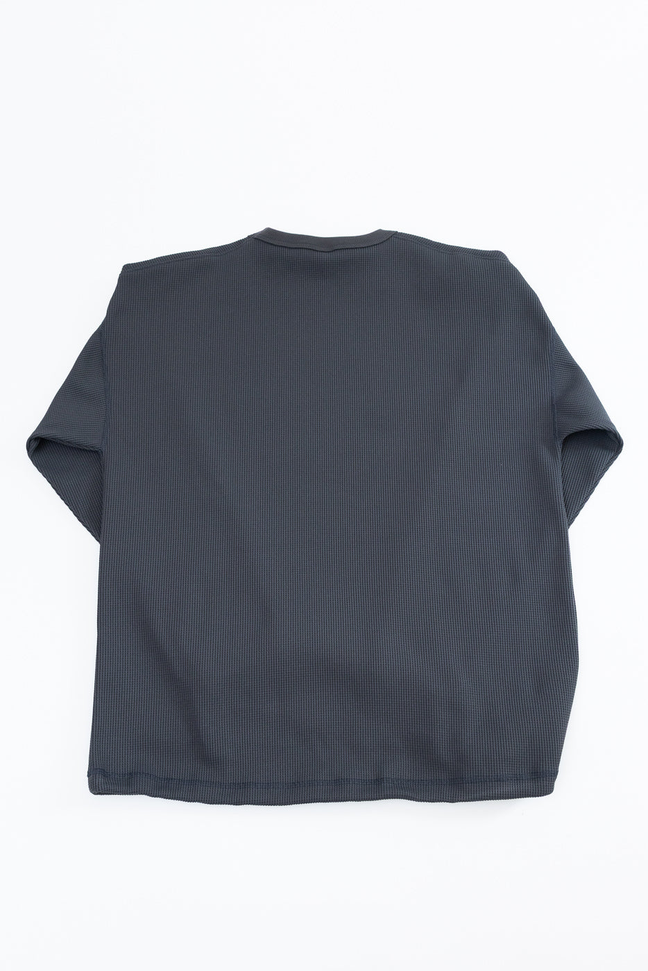 Back view of dark gray waffle knit t-shirt, flat lay, showing ribbed hem and crew neckline