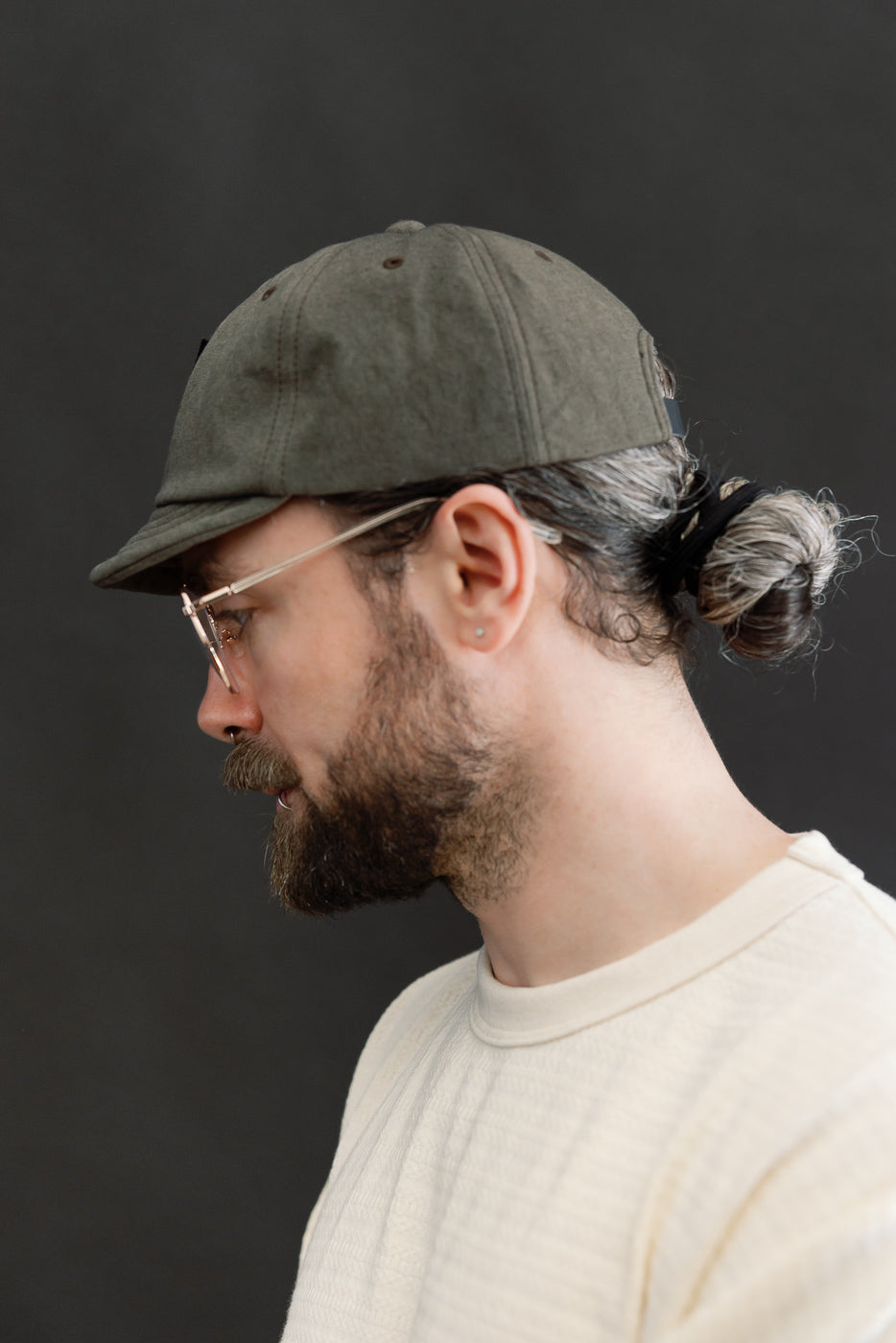Side profile close-up of athletic male model 5'9