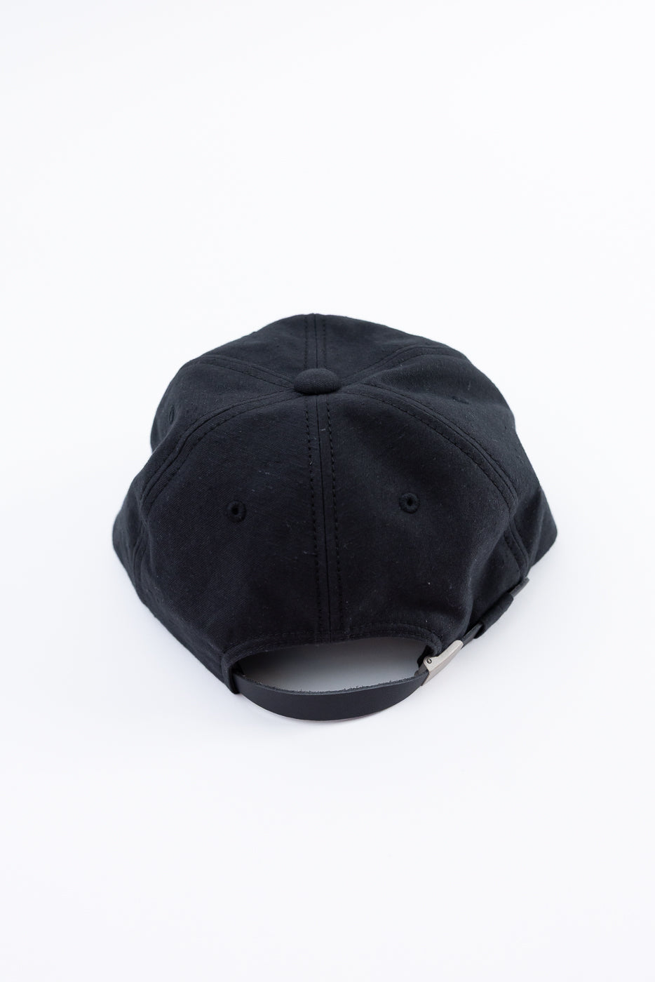 Black baseball cap on a white background
