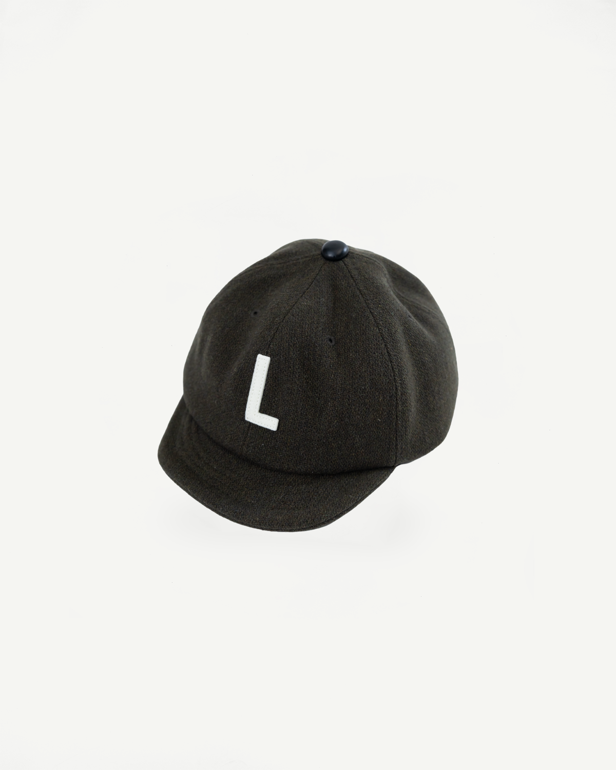 Flat lay, front view of olive melton wool baseball cap with white 'L' appliqué detail.