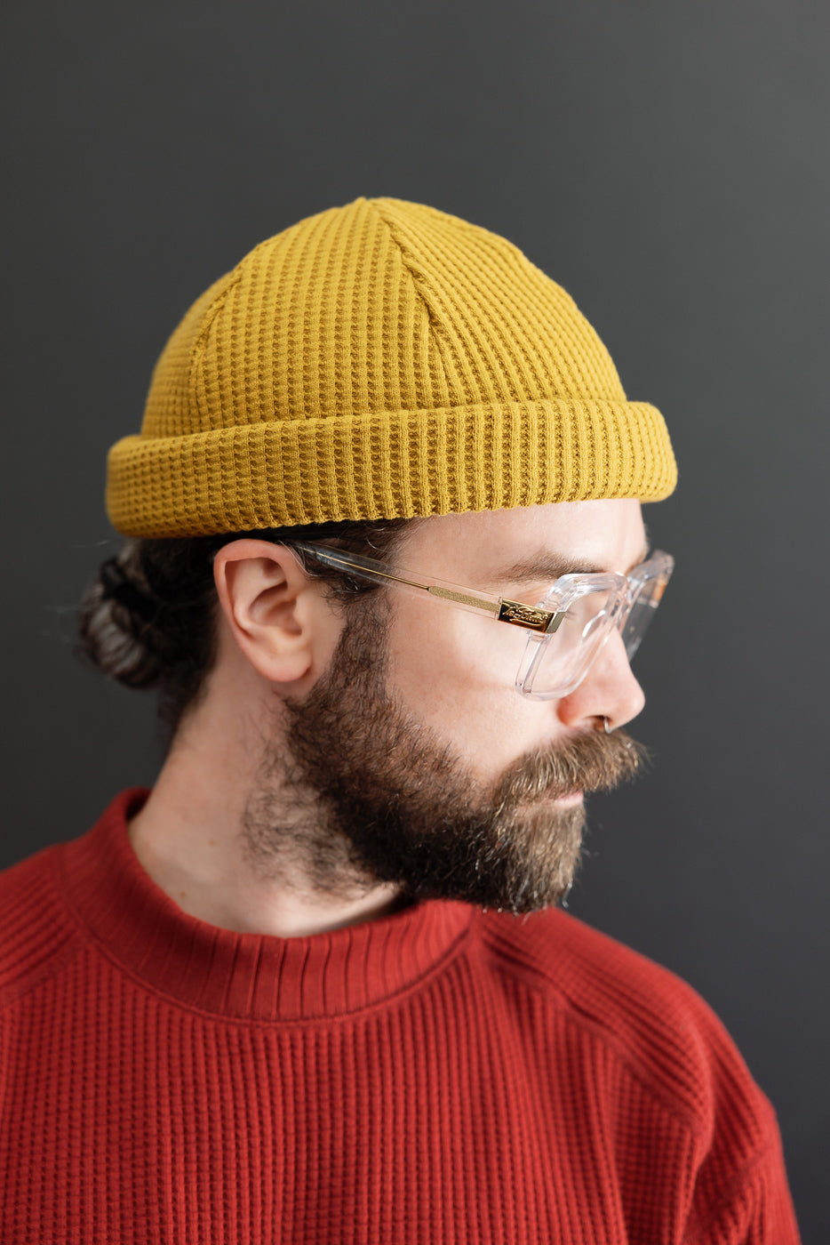 Close-up side view of a male model (5'9