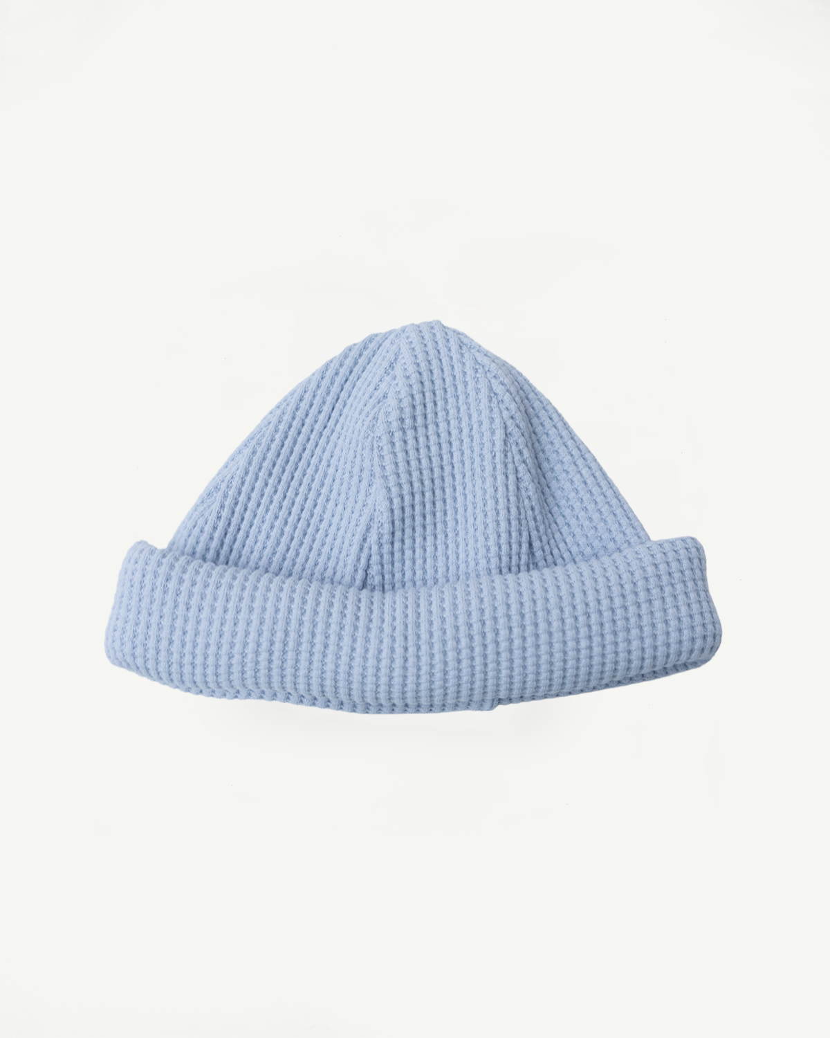 JM6607 - Waffle Knit Cap - 425 Ice Blue: A light-blue, cuffed knit beanie with waffle texture, laid flat, showcasing its extended length and premium craftsmanship from Jackman's Fukui factory, made of 100% cotton.
