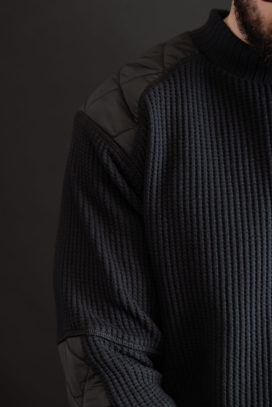 Close-up side view of a male model (5'9