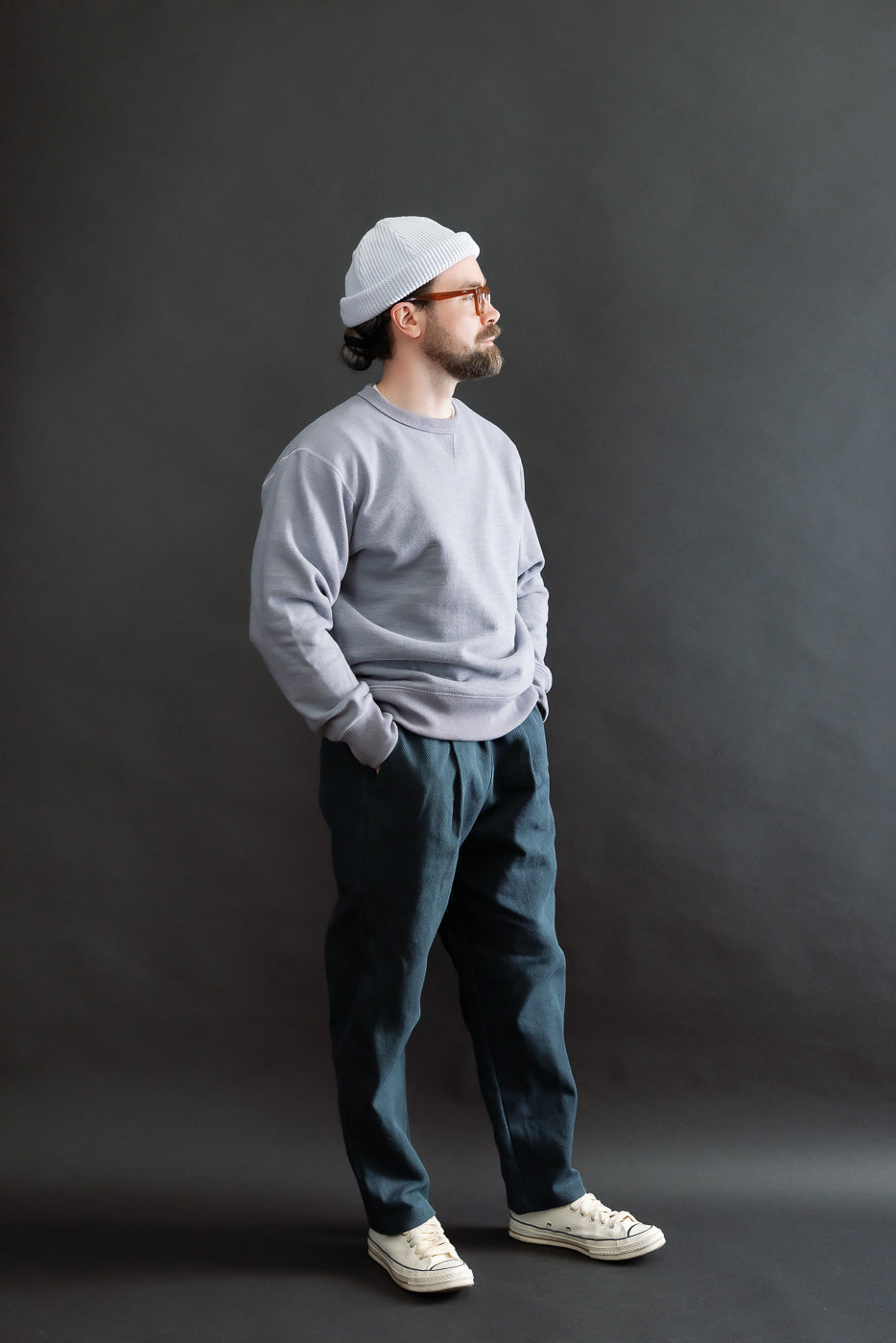 JM7292 - GG Sweat Crewneck - 354 Dry Purple, modeled by a 5'9 Caucasian male, showcases a textured design with reinforced seams and extended ribbing, embodying Dant's premium menswear focus.