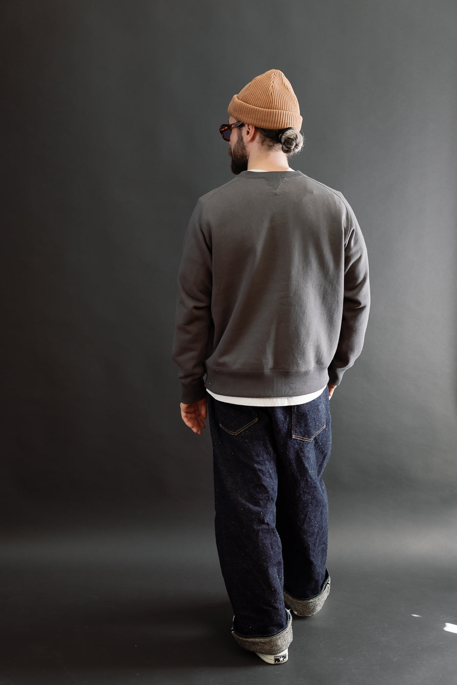 Back view of full body shot of male model, 5'9