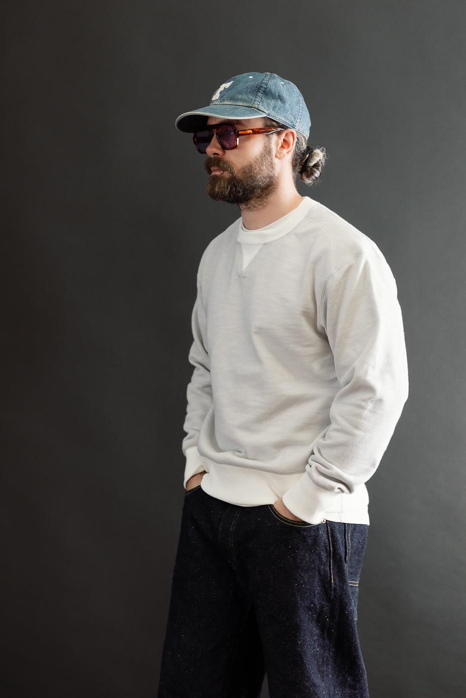 Full body side view of a male model, 5'9