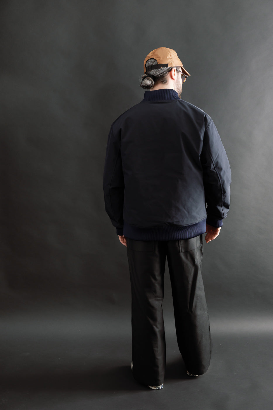 Full body back view of male model 5'9